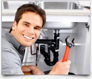 A Friendly Goodyear Plumbing Contractor Goes to Work on a Clogged Sink