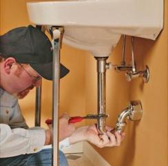 A Plumbing Contractor Fixes a Clogged Sink